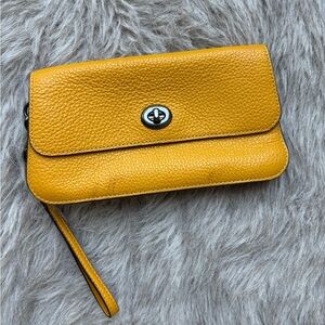 COACH Yellow Clutch with Textured Leather and Flap Closure